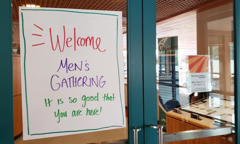 A sign in the Egan Library at the University of Alaska Southeast in Juneau welcomes participants to the Men's Gathering on June 30, 2019.