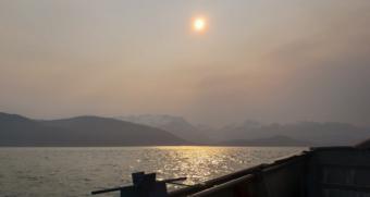 Particulate matter in the air obscures the sun and the view of Herbert Glacier from Lynn Canal near Juneau early on the morning of June 30, 2019.