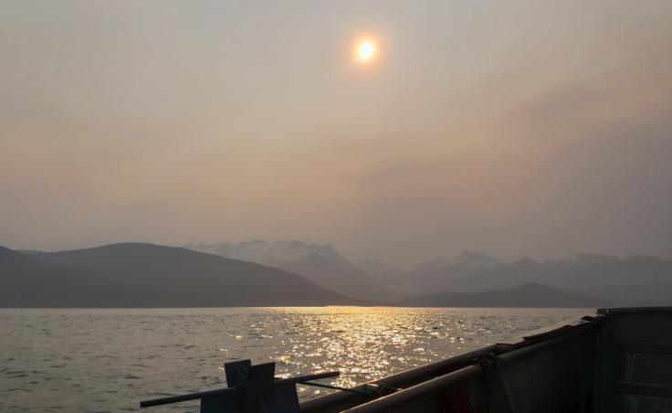Particulate matter in the air obscures the sun and the view of Herbert Glacier from Lynn Canal near Juneau early on the morning of June 30, 2019.