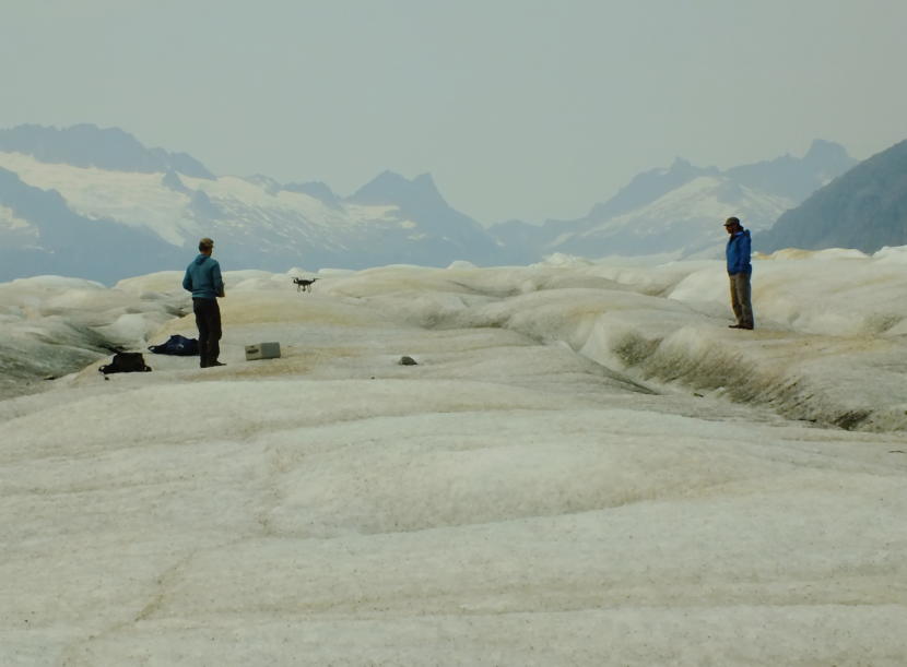 Christian Kienholz of University of Alaska Southeast uses a drone to map Suicide Basin as Aaron Jacobs of the National Weather Service watches.