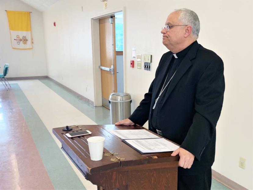 Bishop Andrew Bellisario addresses reporters at St. Ann's Parish Hall on August 21, 2019. (Photo by Adelyn Baxter/KTOO)