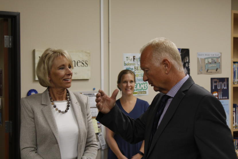 U.S. Education Secretary Betsy DeVos speaks with Mat-Su Central School principal John Brown.