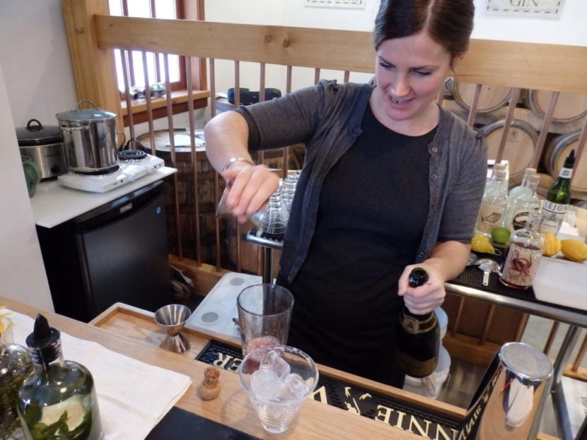 Macky Cassidy mixes a cocktail in the Port Chilkoot Distillery tasting room.