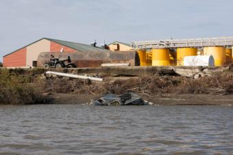 This fuel tank farm now sits empty after rapid erosion forced the Lower Kuskokwim School District to transfer the fuel to new tanks behind the school in Napakiak, Aug. 30, 2019.