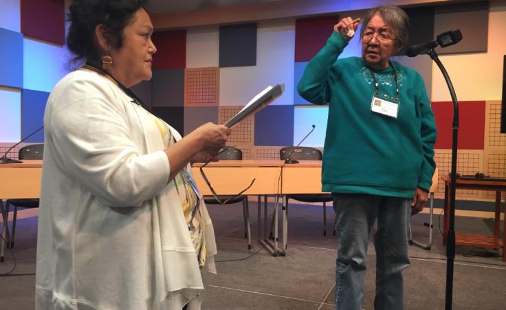 Gus'dutéen Bessie Jim (right) indicates a high tone on a letter at the 4th International Lingít Spelling Bee held in Juneau on Sep. 27, 2019. Virginia Oliver (left) gave the words and served as judge. (Photo by Zoe Grueskin/KTOO)