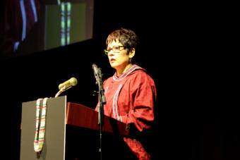 Cook Inlet Region, Inc. President and CEO Sophie Minich speaks about why the Alaska Native corporation supports the recall of Gov. Mike Dunleavy at the Alaska Federation of Natives Convention in Fairbanks on Oct. 18, 2019. (Photo by Casey Grove/Alaska Public Media)