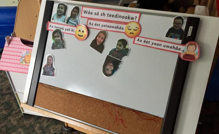 A white board in the Haa Yóo X̱ʼatángi Kúdi immersion classroom, pictured on Oct. 9, 2019, asks students how they feel -- in Lingít. (Photo by Zoe Grueskin/KTOO)