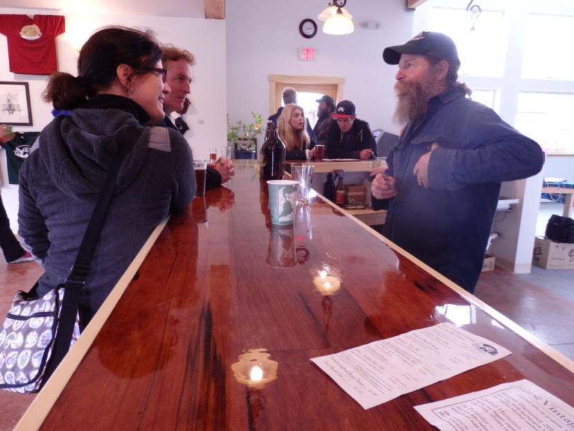 Haines Brewing co-owner Paul Wheeler speaks to customers at the brewery. (Photo by Emily Files/KHNS)