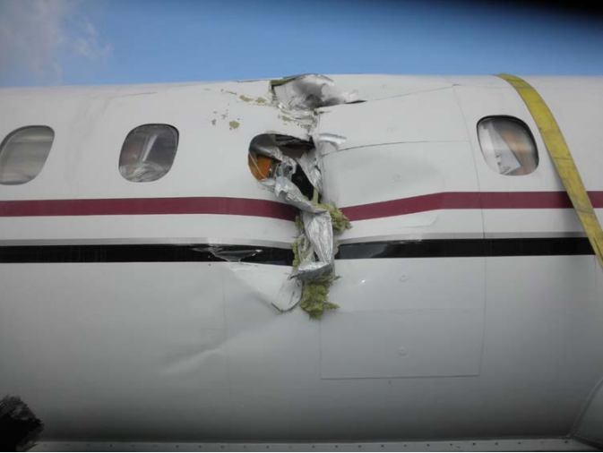 A preliminary National Transportation Safety Board investigation into a fatal PenAir crash in Dutch Harbor on Oct. 17, 2019, includes this photo of damage to the left side of the plane.