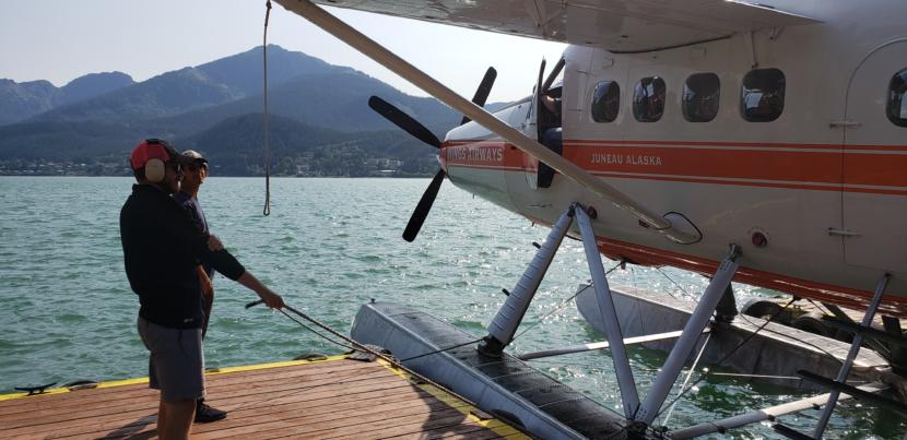 Workers with Wings Airways and Taku Glacier Lodge prepare a floatplane for takeoff in downtown Juneau on Aug. 31, 2019. In the 2000s, the City and Borough of Juneau paid for noise abatement and flightseeing mediation with cruise ship passenger taxes. 