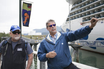 Kirby Day, port operations manager for the Holland America Group, points out changes to the waterfront at the Franklin Dock in downtown Juneau on July 17, 2019. Also pictured: Former Juneau Mayor Bruce Botelho.