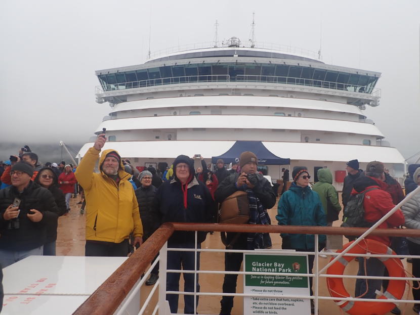Cruise ship passengers on the forward observation deck of the Noordam vie for the best look at glaciers and whales. (Photo by Jacob Resneck/Coast Alaska)