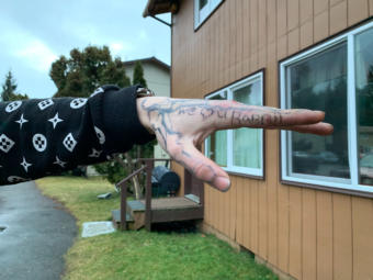 Residents and visitors at the Chinook apartment complex in the Mendenhall Valley show tattoos they were given by Kelly "Rabbit" Stephens on Sunday, Dec. 29, 2019 in Juneau, Alaska. Stephens was killed during an eaerly-morning altercation with Juneau Police. (Photo by Rashah McChesney/KTOO)