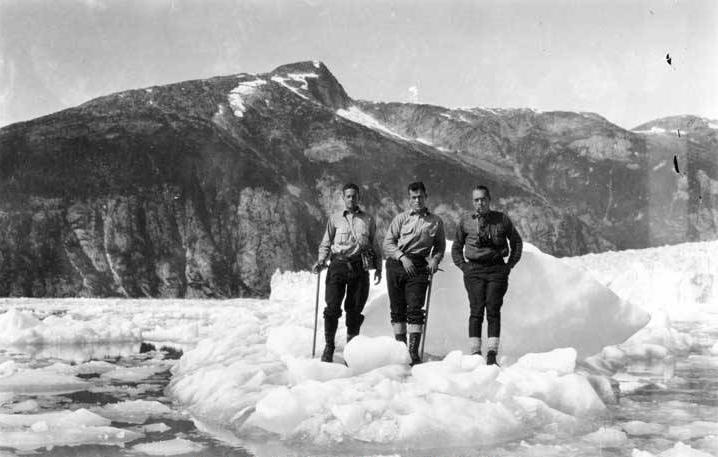 William O. Field (left to right), Benjamin S. Wood and Roscoe Bonsal standing on iceberg at Taku Glacier in 1926. (P87-2592 Alaska State Library - Winter and Pond Photo Collection)