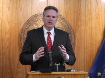 Gov. Mike Dunleavy talks to reporters at a press conference in Juneau on Feb. 19, 2020.