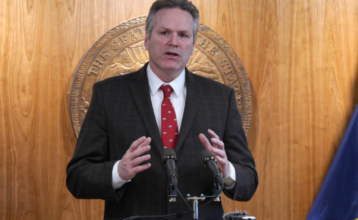 Gov. Mike Dunleavy talks to reporters at a press conference in Juneau on Feb. 19, 2020.