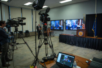 The governor's press team stands by for a press conference in the Atwood Building in Anchorage on March 30, 2020.