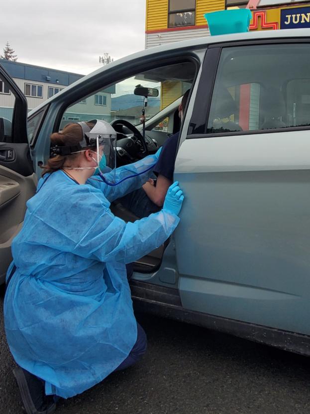 Sky Womack, of Juneau Urgent & Family Care, administers a drive-up test for coronavirus on Thursday, March 19, 2020 in Juneau, Alaska. (Photo courtesy Alicia McGuire) 