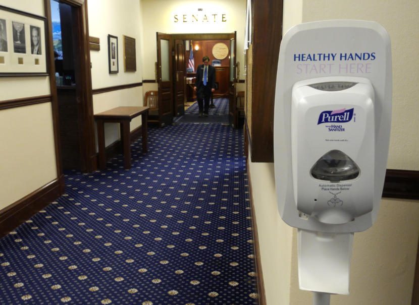 A hand sanitizer dispenser stands outside Senate Chambers in the Alaska State Capitol in Juneau on March 10, 2020. It’s one of many in the legislative floors of the Capitol.