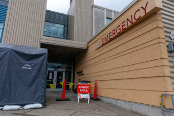 A triage tent is set up to screen patients for symptoms of COVID-19 outside on Monday, April 7, 2020 at Bartlett Hospital in Juneau, Alaska. (Photo by Rashah McChesney/KTOO)