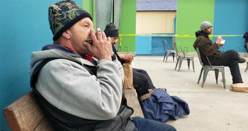 Cary Shilts plays the harmonica during the Glory Hall's lunch service at Zach Gordon Youth Center in Juneau on April 28, 2020.