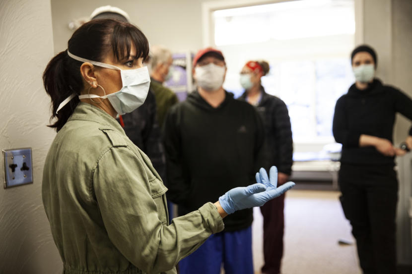 Bartlett Regional Hospital Chief Nursing Officer Rose Lawhorne walks through a newly converted spillover facility designed to house COVID-19 patients on Monday, April 7, 2020 in Juneau, Alaska. The city decided to remove patients from the Rainforest Recovery Center alcohol and drug treatment building and convert it into a facility for non-critical coronavirus patients. (Photo by Rashah McChesney/KTOO)