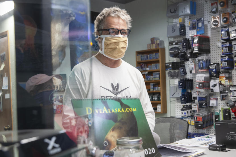 Art Sutch talks to customers during one of his last days operating a brick and mortar camera shop on Saturday, April 25, 2020, in Juneau, Alaska. (Photo by Rashah McChesney/KTOO)