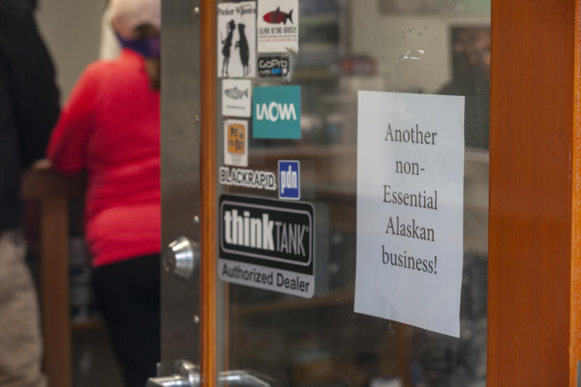 Dave Harris, Art Sutch and Isabel Lee talk about a camera package during one of Sutch’s last days operating a brick and mortar camera shop on Saturday, April 25, 2020, in Juneau, Alaska. (Photo by Rashah McChesney/KTOO)