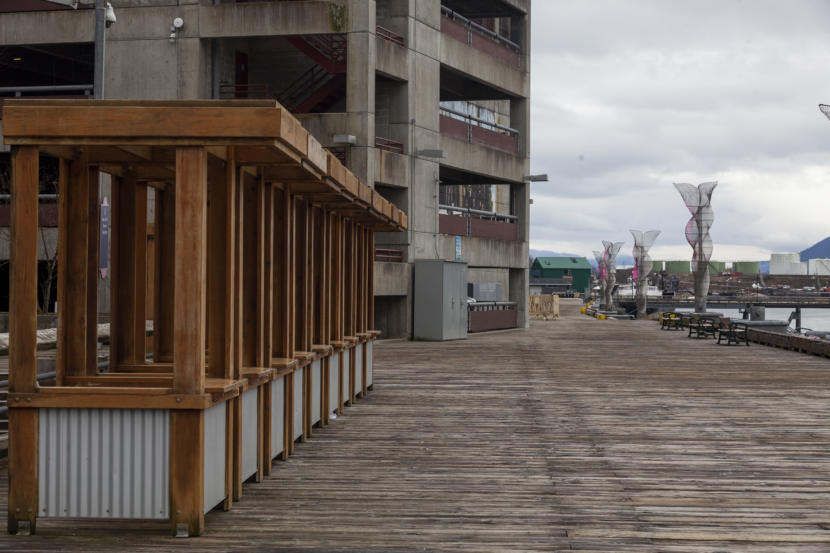 A row of booths used by waterfront vendors during the summer tourist season sit empty on Saturday, March 21, 2020 in Juneau, Alaska. Juneau's Docks and Harbors Board approved a refund fees to use these booths as the COVID-19 pandemic has decimated Alaska's tourism season. (Photo by Rashah McChesney/KTOO)