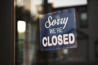 A sign in a window saying "Sorry we're closed."
