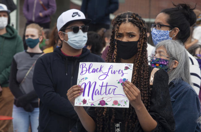 Lacey Davis joined about 250 people gathered for a public “I Can’t Breathe” rally protesting the death of a black man, George Floyd, who was killed after a white officer pressed a knee into his neck while taking him into custody in Minnesota. People held signs decrying violence against black people and calling out institutional racism, many supporting the Black Lives Matter movement on Saturday, May 30, 2020 in Juneau, Alaska. Similar protests happened throughout the state with hundreds turning out in Fairbanks and Anchorage, they’ve also erupted in dozens of cities all over the country. (Photo by Rashah McChesney/KTOO)