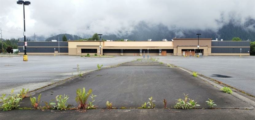 Weeds poke up in the parking lot of a former Walmart at 6525 Glacier Highway in Juneau, pictured here on June 26, 2020.