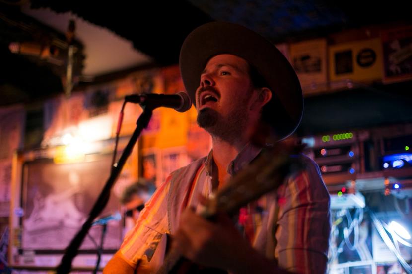 Tyson Davis plays with the band Blackwater Railroad Company, in July of 2019 in Juneau.  Davis tested positive for COVID-19 in late June and is the band is asking people who attended shows in Fairbanks and Seward to get tested for the virus. (Photo courtesy Annie Bartholomew)