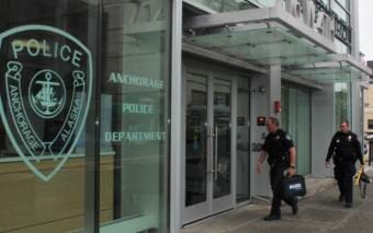 Anchorage police officers enter the downtown headquarters on Tuesday, June 9, 2020.