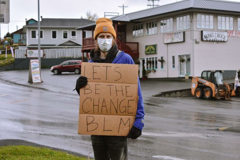 Ron Jackson holds a sign in support of the Black Lives Matter movement in downtown Kodiak. (Photo by Kavitha George/KMXT)