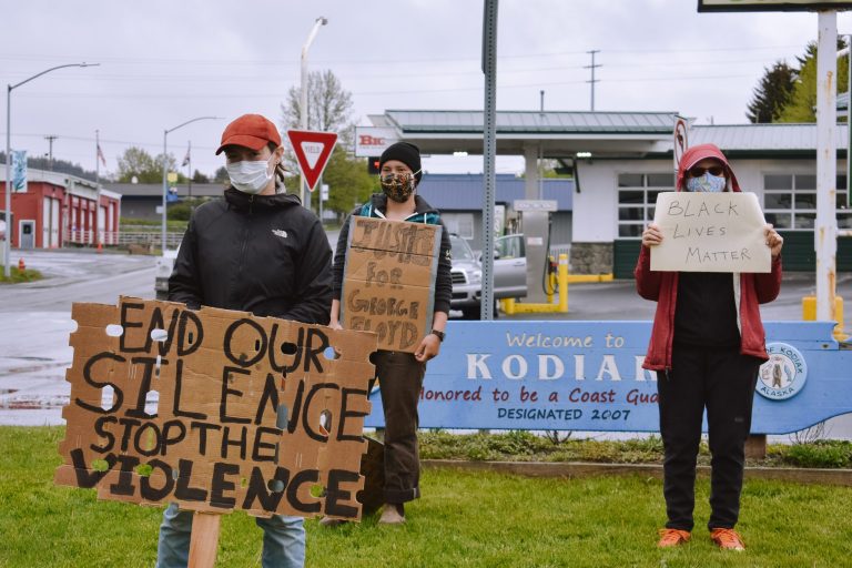 Kari Millstein, Elinore Millstein and Linda Jackson hold signs in support of the Black Lives Matter movement in downtown Kodiak on Sunday afternoon. (Photo by Kavitha George/KMXT)