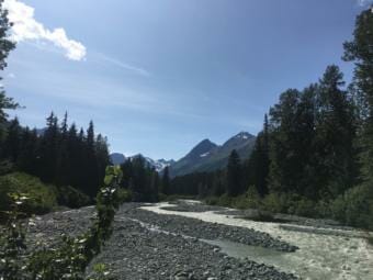A view up Glacier Creek towards Saksaia Glacier and the mountains that hold copper-zine-silver-gold-barite deposits that Constantine Metal Resources is planning to mine. (Photo by Claire Stremple/Alaska's Energy Desk - KHNS)