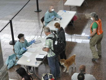 A health screening for travelers at Anchorage's airport