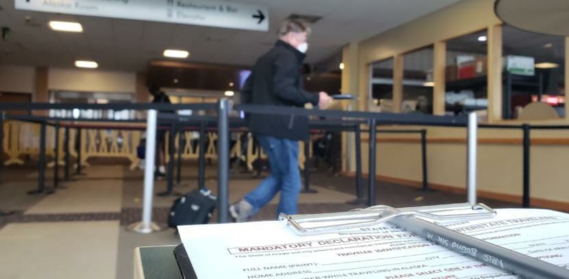 A traveler off of a flight from Seattle makes his way through a COVID-19 screening line at Juneau International Airport on June 26, 2020.