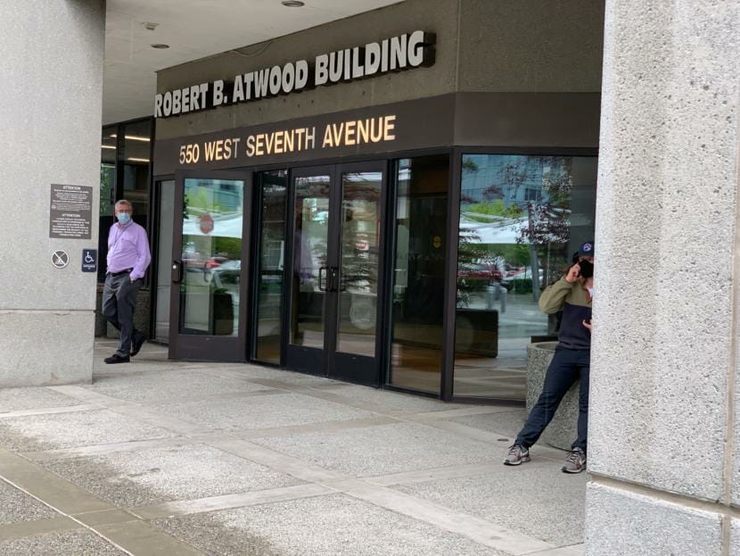Workers were leaving the Atwood Building in downtown Anchorage on Friday, July 24, after concern about COVID-19 cases closed the state office building. (Julia O’Malley/Alaska Public Media)