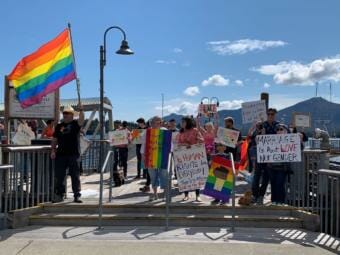Protesters with signs and rainbow flags in Ketchikan