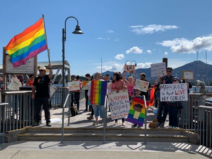 Protesters with signs and rainbow flags in Ketchikan