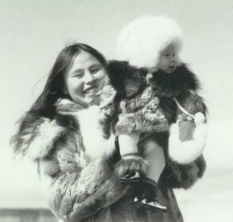 A woman holding up a baby during the 1982 contest.