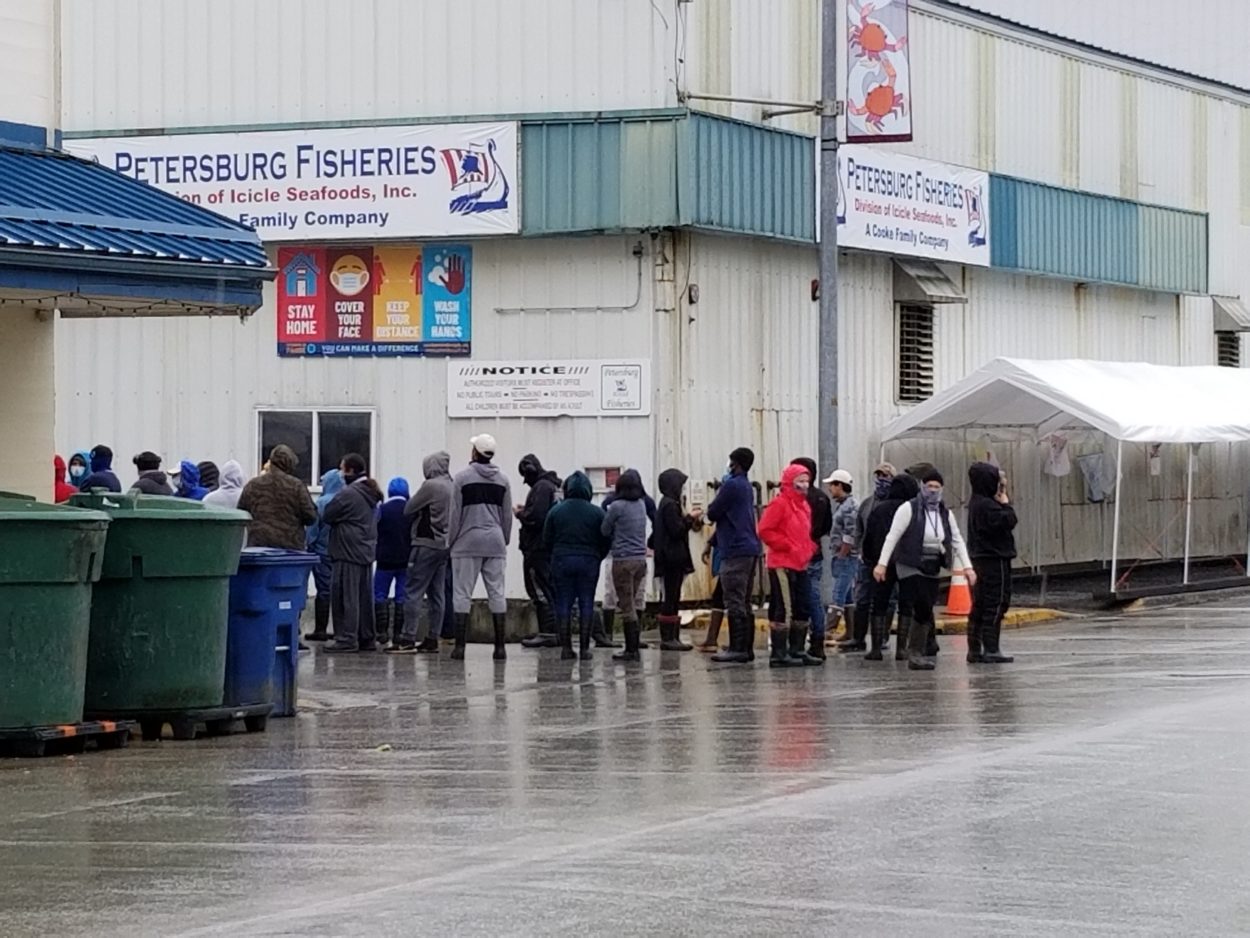 On campuses closed by COVID-19, seafood workers trade freedom for paychecks