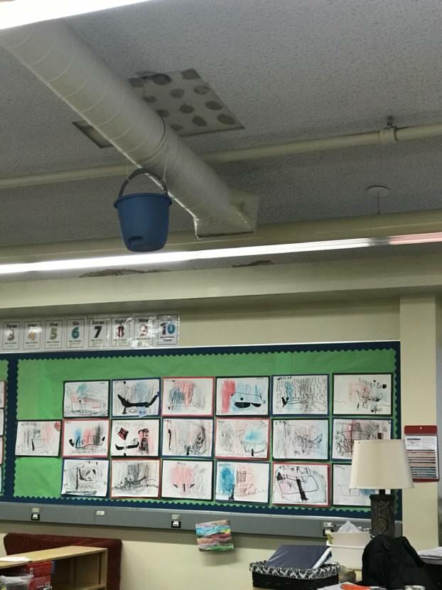 Juneau School Board member Paul R. Kelly snapped this picture of a bucket positioned to catch water leaking through the ceiling and water stains during a tour of Riverbend Elementary School in Juneau on Jan. 22, 2020.