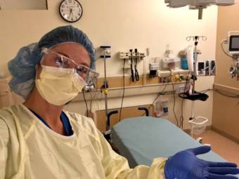 Greer Gehler, an Anchorage emergency room nurse, in full personal protective equipment