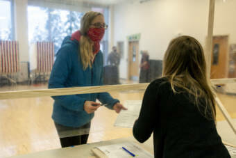 Voters sign for their ballots at the Auk Bay precinct on Tuesday, Nov. 3, 2020, in Juneau, Alaska. (Photo by Rashah McChesney/KTOO)