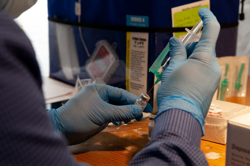 Bartlett Pharmacist Khalid Srour prepares the Pfizer vaccine for dosing during Juneau's COVID-19 vaccine clinic at Centennial Hall on Friday, Jan. 15, 2021, in Juneau, Alaska. (Photo by Rashah McChesney/KTOO)