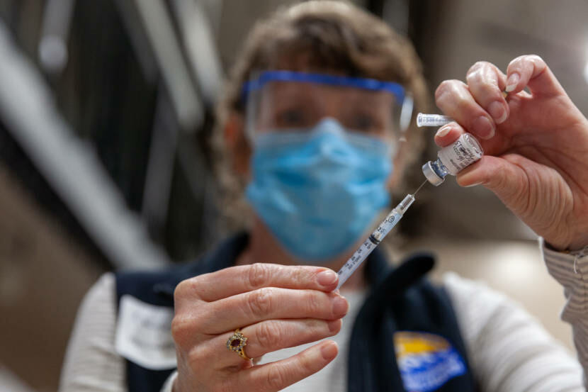 Elaine Hickey, a public health nurse, draws some of Pfizer's vaccine into a syringe during Juneau's COVID-19 vaccine clinic at Centennial Hall on Friday, Jan. 15, 2021. 
