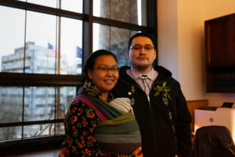 (left) Flora Atqaqsaaq Patkotak holds Elijah Moses Patkotak as she visits her husband, Rep. Josiah Patkotak, on his first day in office as the Representative for House District 40 on Tuesday, Jan. 19, 2021, in Juneau, Alaska. (Photo by Rashah McChesney/KTOO)